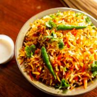 Vegetable Biryani · Indian Basmati Rice cooked with mixed vegetables Cashew Nuts and Raisins