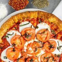 Margarita Pizza · Plum tomato sauce and fresh mozzarella.