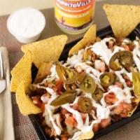 Nachos · Chips, cheese, beans, pico de gallo, and refried beans. jalapenos  grilled veggie.