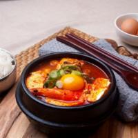 Spicy Soft Tofu Soup With Rice · Spicy soft tofu soup with rice (mushroom, zucchini, soft tofu, scallion, onion).