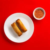 Spicy Egg Rolls · Golden flaky veggie filled egg rolls with a sweet and sour dipping sauce.