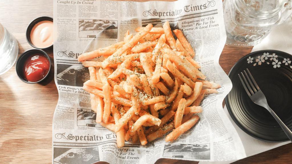 Truffle Fries · Deep fried fries topped with parmesan cheese, parsley and truffle oil served with ketchup