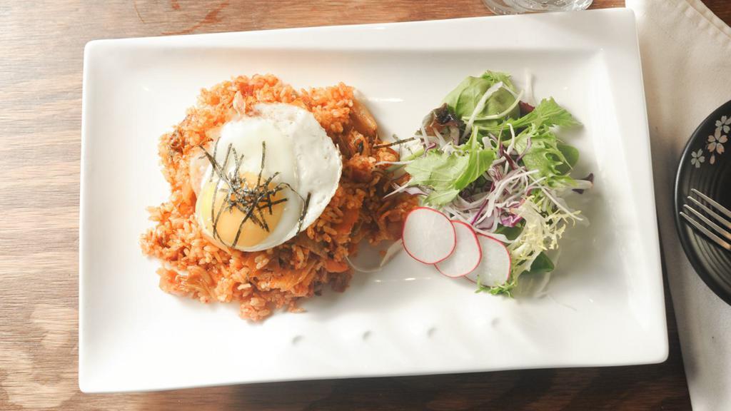 Kimchi Fried Rice · Pan fried white rice with kimchi, and vegetable and two sunny side up eggs
