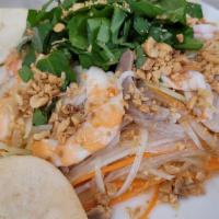 Papaya Salad With Shrimp, Pork/Beef Jerky / Goi Du Du Tom Thit/Kho Bo · Shredded green papaya, shrimp, pork, coriander, mint, onion, peanut, shallot & dressing.