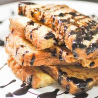 3 Slices Of French Toast With Chocolate Chips · 3 Perfectly cooked French Toast slices, topped with sweet chocolate chips.