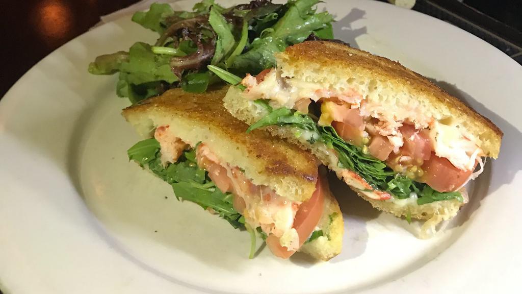 Lobster Grilled Cheese · Sandwich with mascarpone, aged provolone, scallions, roma tomato and baby arugula.