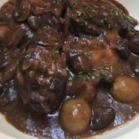 Coq Au Vin · Chicken stewed in red wine, juniper and pearl onions with risotto.