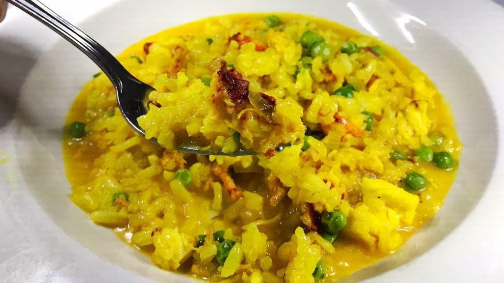 Lobster Risotto · With saffron and peas.