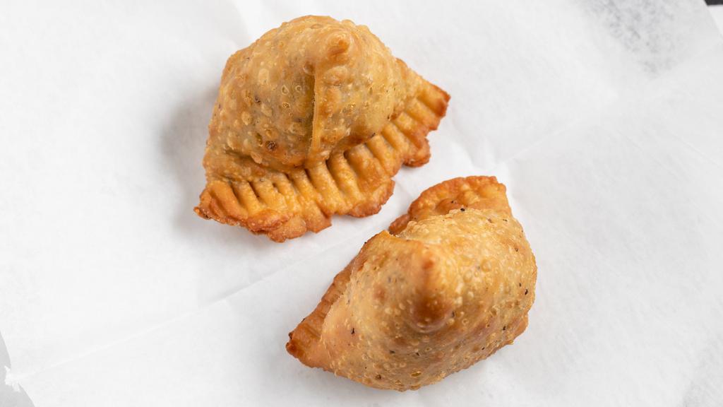 Vegetable Samosa · Top menu item. Crisp golden brown triangle pastry stuffed with spiced potatoes and green peas.
