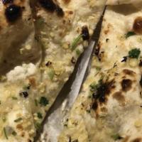 Garlic Naan · Top menu item. Bread from fermented dough flavored with garlic flakes coriander.