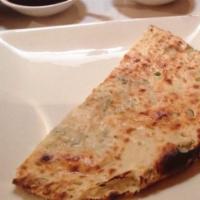 Naan · Top menu item. Bread made from enriched fermented dough.