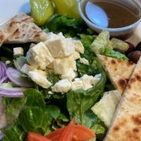 Greek Salad · Romaine, feta, kalamata olives, tomato, cucumber, red onion, croutons, red wine vinaigrette.