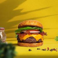 Back To Bacon Vegan Burger · Seasoned vegan burger patty topped with melted vegan cheese, layers of crispy vegan bacon, l...