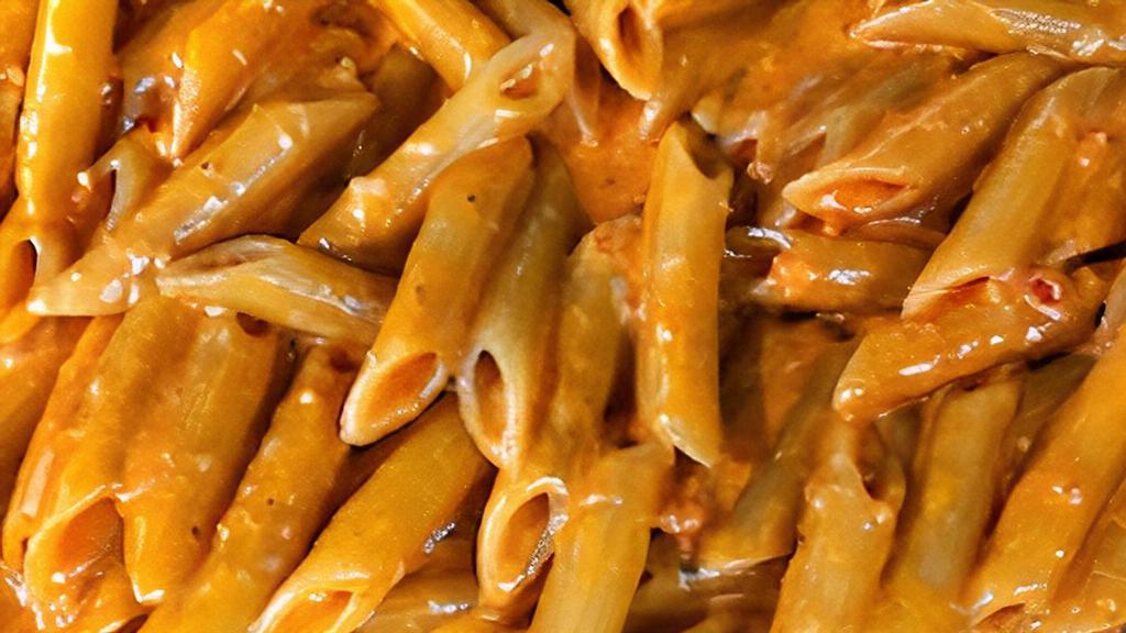 Penne Alla Vodka · Classic creamy vodka sauce topped with fresh basil.