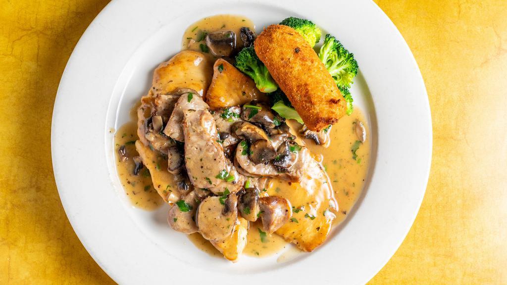 Pollo Scarpariello · Breasts of chicken with sweet sausage, garlic, rosemary, fresh thyme and mushrooms cooked in a white wine sauce. Served with a vegetable and potato croquette.