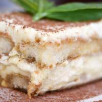 Homemade Tiramisu · Layers of espresso soaked ladyfingers separated by mascarpone cream and dusted with cocoa po...