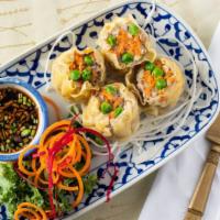 Kanom Jeeb · Steamed dumpling stuffed with minced pork, shrimp, and water - chestnut served with home-mad...