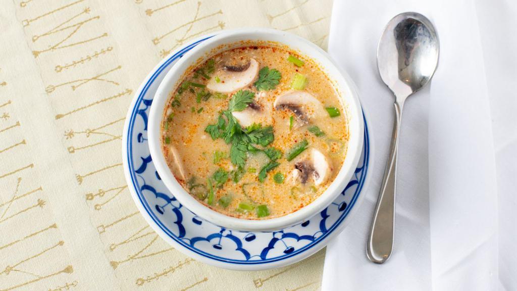 Tom Kha Gai · Most famous heartily aromatic herbs soup, sliced chicken breast with coconut milk, galangal, chili, and fresh lime juice.