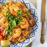 Pad Thai · Stir-fried rice noodles tossed with shrimp, egg, firm tofu, bean sprout topped with ground p...