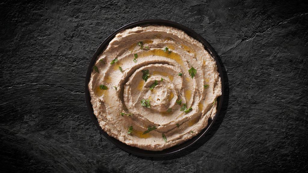Arabian Baba Ghanoug · Made from Char-Grilled eggplant, blended with tahini, garlic, lemon juice, and parsley