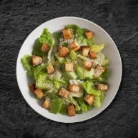 Caesar Feast Salad · Made with fresh Romaine lettuce tossed with Parmesan cheese, croutons, and homemade Caesar d...