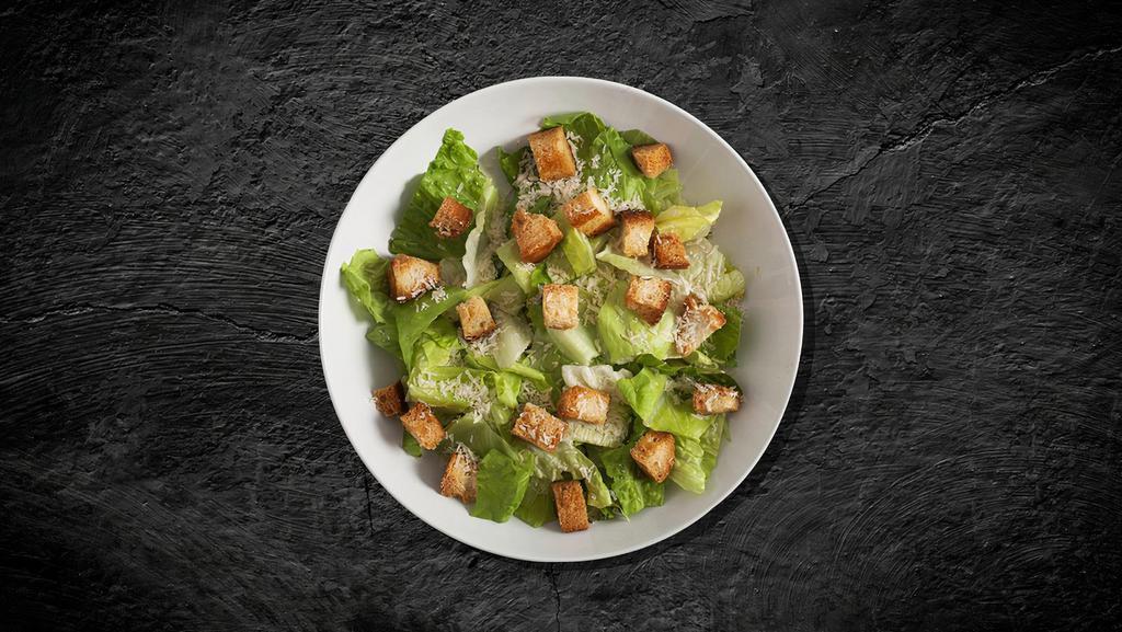 Caesar Feast Salad · Made with fresh Romaine lettuce tossed with Parmesan cheese, croutons, and homemade Caesar dressing