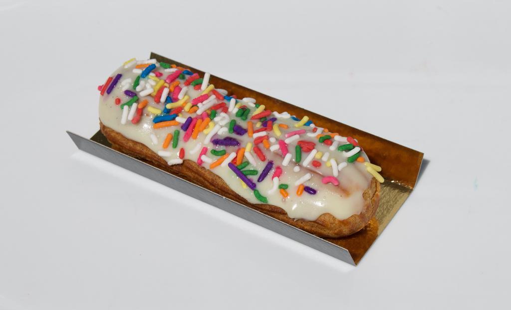 Eclair  Birthday Cake · Birthday cake flavored pastry cream with vanilla glaze and rainbow sprinkles