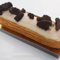 Eclair  Cookies & Cream · Cookies & cream pastry cream with vanilla glaze, topped with oreos.