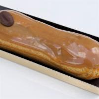 Eclair  Coffee · Coffee pastry cream and glaze, topped with a chocolate coffee bean.