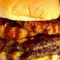 The Cowboy Burger · Double burger patties, bacon, cheddar cheese, onion rings, banana peppers and BBQ sauce.