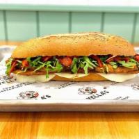 Eggplant Milanese · Crispy fried eggplant, provolone cheese, arugula, roasted red peppers, balsamic glaze on a s...