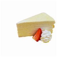 Vanilla Bean Crêpe Cake · Contains: Eggs, dairy, gelatin, gluten. 15 layers of crêpes filled with vanilla cream. Duste...