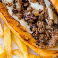 Philly Cheesesteak · Tender Ribeye or Chicken Steak, melted cheese and toppings of your choice hugged by a fresh ...