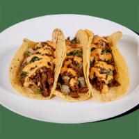 Tacos - Signature Tacos - Barbacoa Beef · Contains: Chipotle Sauce, Barbacoa Beef, Cilantro Relish