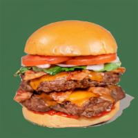 Double Bacon Cheeseburger · Contains: Cheddar, Onions, Tomato, Bacon, Green Leaf Lettuce, Brioche Bun, Ketchup, Hamburger