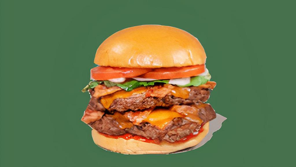 Double Bacon Cheeseburger · Contains: Cheddar, Onions, Tomato, Bacon, Brioche Bun, Ketchup, Hamburger
