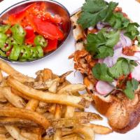 Harissa Chicken Tinga · Harissa marinated pulled rotisserie chicken. Served over challah with side of fries, Italian...