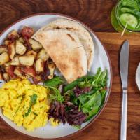 Two Eggs Any Style · Home fries, mixed green salad & multi-grain toast.