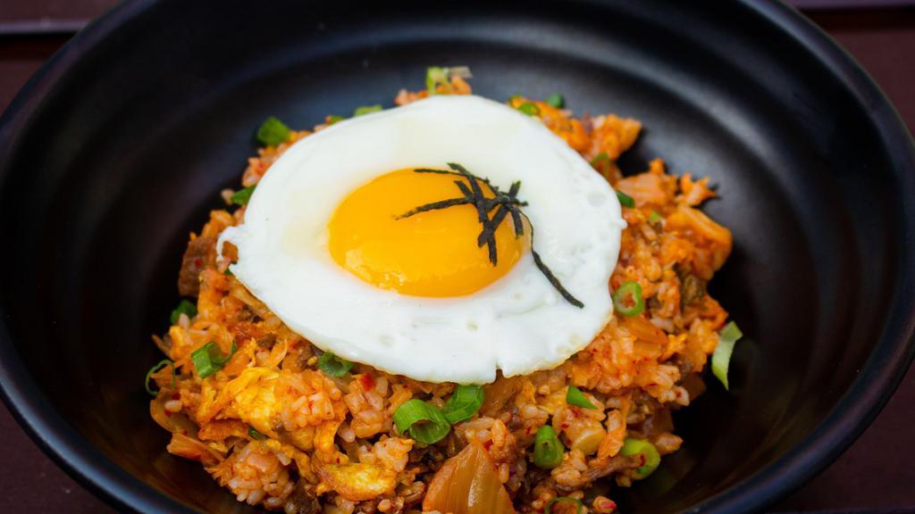 Kimchi Fried Rice (Spicy) · Fried rice with diced kimchi, onion, ground beef and topped with fried egg. Served with miso soup on the side.