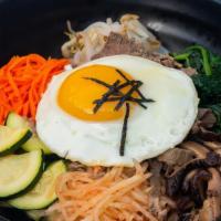 Bibimbap · Steamed white rice with assorted vegetables, ground beef, and topped with fried egg with spi...