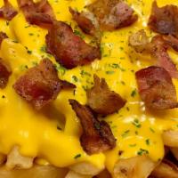Bacon & Cheese Fries · Fries topped with melted spicy cheddar cheese and bacon. Served with ketchup.
