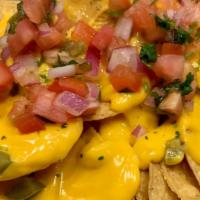 Nachos · Nacho chips with melted cheddar cheese, jalapeno peppers, and pico de gallo