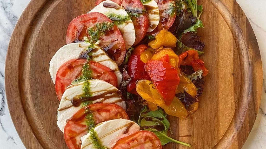 Caprese Salad · Fresh mozzarella, tomato, roasted red peppers, pesto, aged balsamic glaze