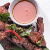 Deep-Fried Pork Strip (Moo Dade Deaw) · This dish includes succulent pork sliced thin and marinated in a sugar and salt brine, then ...