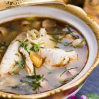 Classic Tom Yum · Popular, spicy. Our famous spicy and sour soup is served simmering with chicken, straw mushr...