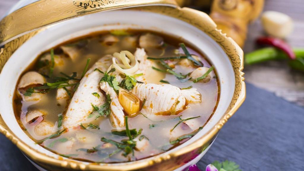Classic Tom Yum · Popular, spicy. Our famous spicy and sour soup is served simmering with chicken, straw mushroom caps, lemongrass, galangal root, spring onions, red onion, and cilantro.