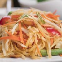 Green Papaya Salad (Som Tum)* · Gluten-free. Featuring shredded papaya, dried shrimp, tomatoes, carrots, green beans, lime j...