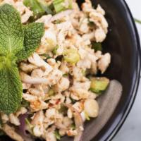 Larb Salad · A flavorful Thai style salad of minced chicken or pork with red onions, spring onions, cilan...