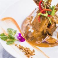 Massaman Curry · Gluten-free. A mild southern-style curry of slowly simmered lamb rack, potatoes, peanuts, an...