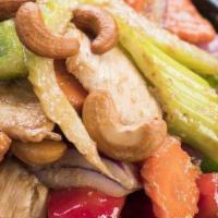 Cashew Nut Chicken · Spicy. Sliced chicken breast stir fried in our famous cashew nut sauce with red and green be...